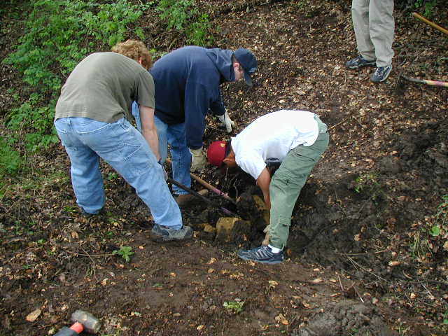 Jonah, Robert and Davis removing a rock for the culvert (2)